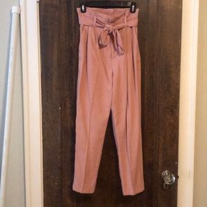 High-waisted paper bag pants.